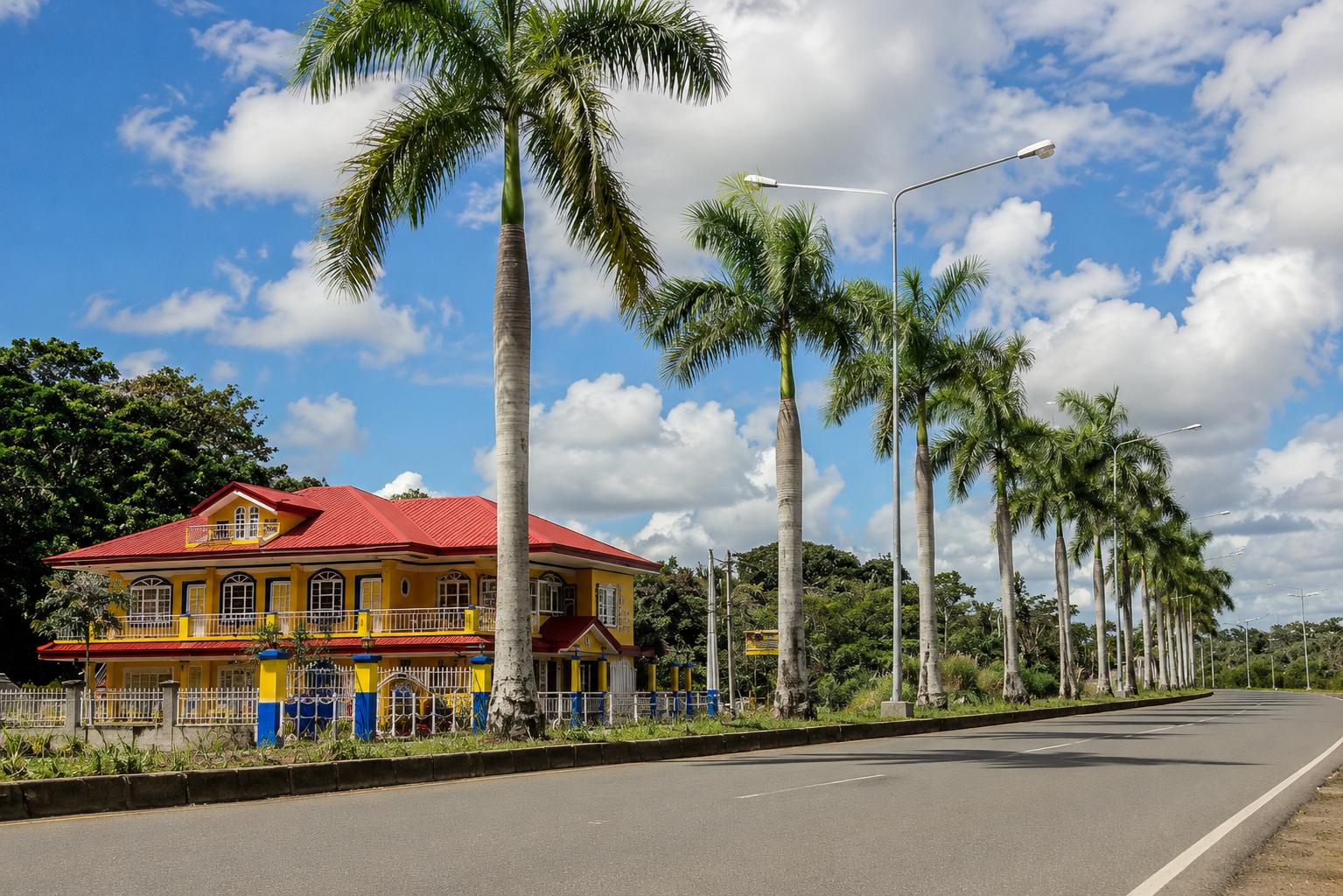 Arriving at the yellow and blue Pecan Pension House along the palm-lined highway in Iloilo