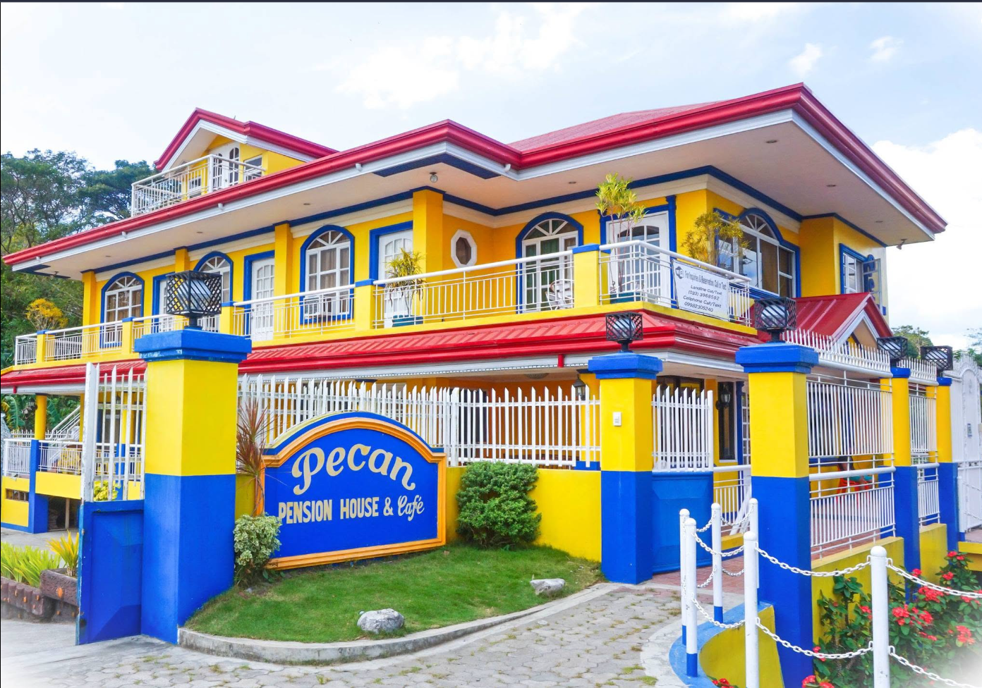 Front entrance and signage of Pecan Pension House & Café near Iloilo International Airport