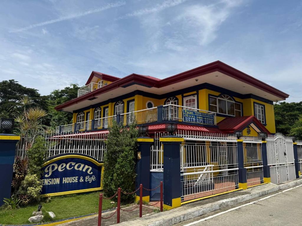 Front facade and signage of Pecan Pension House & Café in Iloilo City